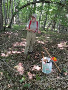 Mr. Ken Feathers explains the bucket of tools he uses while doing invasive plant management on his property.
